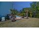 Expansive backyard with mature landscaping, pool and patio area at 221 Obsidian Dr, Holly Springs, NC 27540