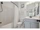Bathroom featuring a tub/shower combo, toilet and vanity with a single sink at 221 Obsidian Dr, Holly Springs, NC 27540