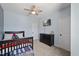 Bedroom featuring a bed, ceiling fan, a TV, and a chest of drawers for storage at 221 Obsidian Dr, Holly Springs, NC 27540
