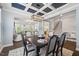 The elegant dining area features an open floor plan and stylish seating for six at 221 Obsidian Dr, Holly Springs, NC 27540