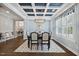 Charming dining room with a coffered ceiling, setting a formal tone for elegant dinners at 221 Obsidian Dr, Holly Springs, NC 27540