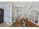 Bright foyer featuring hardwood floors and a decorative console table displaying elegant decor at 221 Obsidian Dr, Holly Springs, NC 27540