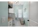 Functional laundry room with built-in cabinets, countertop and laundry basket at 221 Obsidian Dr, Holly Springs, NC 27540