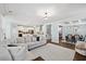 Spacious living room with fireplace open to dining and a gourmet kitchen with an island at 221 Obsidian Dr, Holly Springs, NC 27540