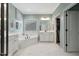 Bright main bathroom featuring soaking tub, walk-in closet, double vanity and shower at 221 Obsidian Dr, Holly Springs, NC 27540