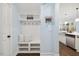 Mudroom with a built-in bench, storage cubbies, coat hooks, and decorative pillows for a functional space at 221 Obsidian Dr, Holly Springs, NC 27540