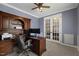 Inviting home office with custom wood built-ins and double french doors to maximize sunlight at 221 Obsidian Dr, Holly Springs, NC 27540