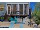 Charming patio and screened porch area with chairs and outdoor decor at 221 Obsidian Dr, Holly Springs, NC 27540