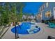Inviting backyard pool area with in-pool seating and professional landscaping at 221 Obsidian Dr, Holly Springs, NC 27540