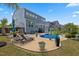 Inviting backyard pool with lounge chairs and patio, perfect for relaxing and entertaining outdoors at 221 Obsidian Dr, Holly Springs, NC 27540