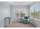 Charming sitting room area with natural light and comfortable seating at 221 Obsidian Dr, Holly Springs, NC 27540