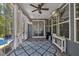 Sunroom featuring white curtains, a ceiling fan, television, and access to a pool at 221 Obsidian Dr, Holly Springs, NC 27540