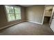 Cozy bedroom with carpet, natural light, and closet at 2405 Pearces Rd, Zebulon, NC 27597