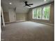 Bonus room with plush carpet, natural light, and a ceiling fan at 2405 Pearces Rd, Zebulon, NC 27597