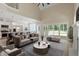 Spacious open-concept living room with modern furnishings and access to the kitchen at 2405 Pearces Rd, Zebulon, NC 27597