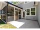 Back patio features a screened in porch and a nice outdoor patio area at 2405 Pearces Rd, Zebulon, NC 27597