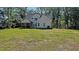 Charming light blue home with a screened porch and spacious green backyard perfect for outdoor activities at 2405 Pearces Rd, Zebulon, NC 27597