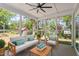 Cozy screened porch with comfortable seating, perfect for relaxing and enjoying the outdoors at 2405 Pearces Rd, Zebulon, NC 27597