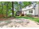 Spacious backyard featuring a screened-in porch, wooden stairs, lawn, and concrete patio at 2481 Foxwood Dr, Chapel Hill, NC 27514