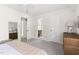 Cozy bedroom featuring neutral colors and doorways to the en suite bathroom and closet at 2481 Foxwood Dr, Chapel Hill, NC 27514