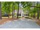 Charming home exterior with brick walkway, manicured landscaping, and ample parking space at 2481 Foxwood Dr, Chapel Hill, NC 27514