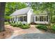 A beautiful home with a winding brick driveway and a welcoming front exterior at 2481 Foxwood Dr, Chapel Hill, NC 27514