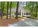 Picturesque home with a brick driveway, surrounded by lush trees for enhanced privacy at 2481 Foxwood Dr, Chapel Hill, NC 27514