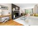 Bright living room with a modern fireplace, hardwood floors, and ample natural light at 2481 Foxwood Dr, Chapel Hill, NC 27514