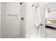A modern shower with white subway tiles and a view of the bedroom at 2481 Foxwood Dr, Chapel Hill, NC 27514