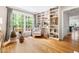 Bright sitting area with built-in bookshelves and a large window offering scenic views at 2481 Foxwood Dr, Chapel Hill, NC 27514