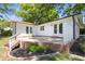 Backyard featuring a patio area with a white privacy fence and a garden bed at 2505 Catalina Ct, Raleigh, NC 27607