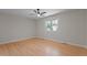 Bedroom featuring hardwood floors, neutral walls, ceiling fan, and natural light at 2505 Catalina Ct, Raleigh, NC 27607