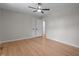 Bright, neutral bedroom with hardwood floors, ceiling fan, and large closets at 2505 Catalina Ct, Raleigh, NC 27607
