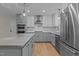 Updated kitchen featuring stainless steel appliances, lots of cabinet space and an island with a stone countertop at 2505 Catalina Ct, Raleigh, NC 27607