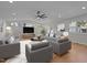 Bright living room featuring recessed lighting, hardwood floors, and contemporary decor at 2505 Catalina Ct, Raleigh, NC 27607