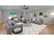 Stylish living room with modern furnishings, light hardwood floors, and abundant natural light at 2505 Catalina Ct, Raleigh, NC 27607