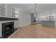 Spacious room with hardwood floors, a fireplace and open access to the kitchen area at 2505 Catalina Ct, Raleigh, NC 27607