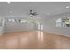 Spacious living area featuring recessed lighting, ceiling fan, hardwood flooring and access to the yard at 2505 Catalina Ct, Raleigh, NC 27607