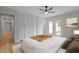 Cozy main bedroom with french doors, a ceiling fan, and ample closet space at 2505 Catalina Ct, Raleigh, NC 27607