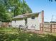 Rear view of a cozy home featuring an entrance with steps, vinyl siding, and a private backyard at 2600 Newbold St, Raleigh, NC 27603
