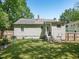 Exterior rear view of a comfortable home with vinyl siding, showcasing the backyard and a sense of privacy at 2600 Newbold St, Raleigh, NC 27603