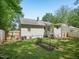 View of backyard featuring lawn, partial fence and back of the house at 2600 Newbold St, Raleigh, NC 27603