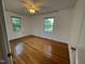 Bright and airy bedroom featuring hardwood floors and natural light from the windows, creating a peaceful retreat at 2600 Newbold St, Raleigh, NC 27603