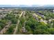 Aerial view of a residential area with tree-lined streets and various houses, capturing the essence of suburban living at 2614 Cambridge Rd, Burlington, NC 27215