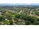 Aerial shot showcasing a neighborhood with lush green trees and well-maintained homes, creating a peaceful and serene setting at 2614 Cambridge Rd, Burlington, NC 27215