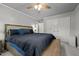 Calm bedroom features a large bed, ceiling fan, and closet at 2614 Cambridge Rd, Burlington, NC 27215