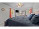 Bedroom has a large bed, ceiling fan, and windows for ample natural light at 2614 Cambridge Rd, Burlington, NC 27215