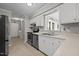 Well-lit kitchen features stainless steel appliances, neutral countertops, and a window above the sink at 2614 Cambridge Rd, Burlington, NC 27215
