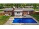 Backyard swimming pool with diving board and access ladder, perfect for summer fun at 2614 Cambridge Rd, Burlington, NC 27215