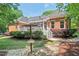 Backyard with porch views and landscaped features, ideal for outdoor living at 27 Woodgate Ct, Durham, NC 27713